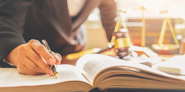 judge-gavel-with-justice-lawyers-having-team-meeting-law-firm-background